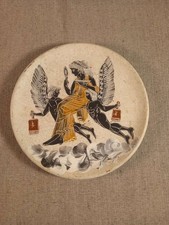 Assiette décorative en terre