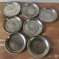 7 Coupelles Ramasse Monnaie dessous bouteille objet publicitaire Vittel en métal