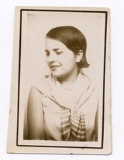 Vintage photo booth - pretty young woman with short hair looking on the side