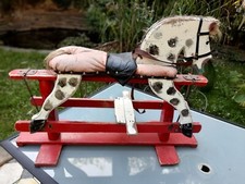 Ancien cheval bascule en - a,