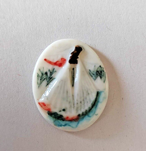 Fève plate représentant des