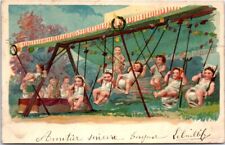 carte postale fantaisie  bebe sur des balancoires