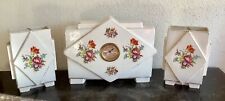 Horloge et 2 vases en
