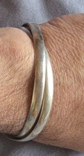 Bracelet double jonc enlacés