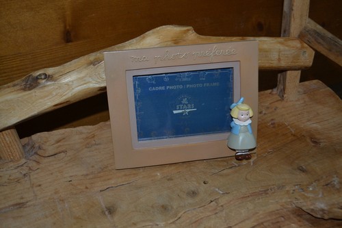 Cadre avec figurine - la,