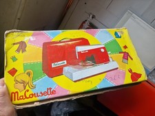 Machine à coudre orange