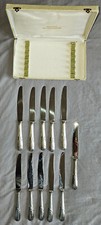 François FRIONNET Coffret 11 couteaux  métal argenté style Louis XV feuillagé