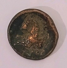 Pièce antique grecque tête