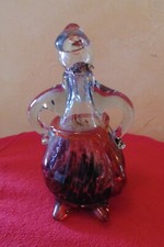 Carafe en verre soufflé représentant un personnage. Hauteur 21 cm 