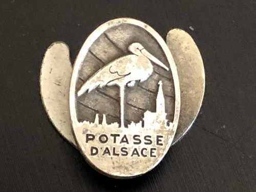 Insigne commerçant la - de,