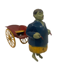 jouet ancien pousse pousse chinois en tôle peinte circa 1930  . XX siècle .