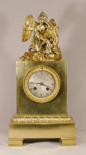 Pendule borne angelot et - borne, à