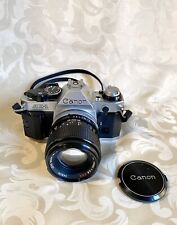 Appareil photo Argentique Canon ae1 program + Objectif Lens FD 100mm 1.2.8 SSC