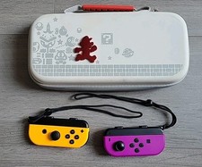 Nintendo switch paire joy con officiel + saccoche  de transport officiel Mario