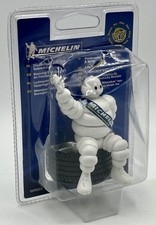 Figurine michelin assis sur - michelin,