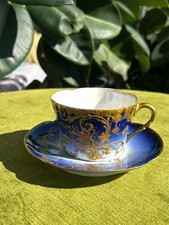 Tasse et soustasse ancienne en porcelaine bleue et or France XIXe siècle