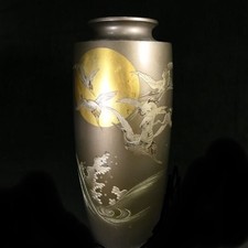 Vase en cuivre pot grues