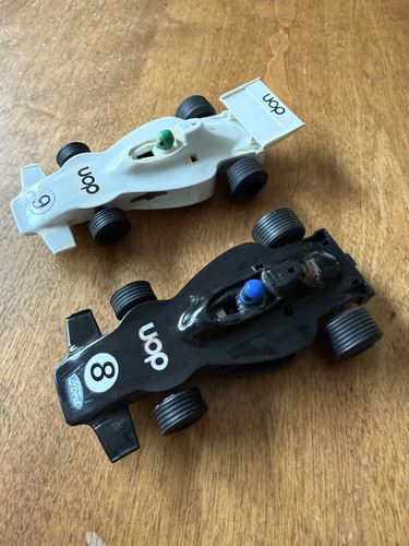 Two running scalextric - two,