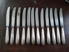 12 COUTEAUX METAL ARGENTE