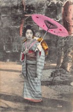 Japan - Geisha carrying a baby and a pink umbrella