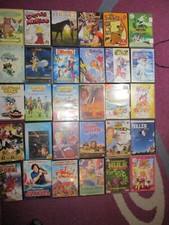 Gros lot de 30 dvd enfant . Differents titres .Voir photos