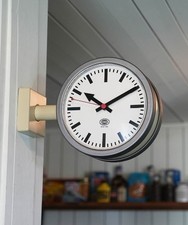 Horloge murale double face