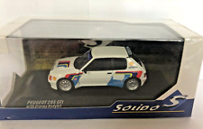 VOITURE PEUGEOT 205 GTI AVEC KIT CAROSSERIE DIMMA BLANC BLEU ROUGE  1/43 SOLIDO