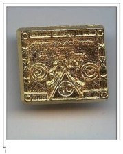 fève métal doré -