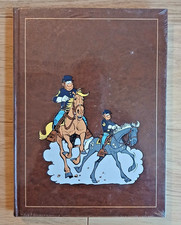 ROMBALDI TUNIQUES BLEUES INTEGRALE  tome 7 BD  ETAT NEUF sous blister