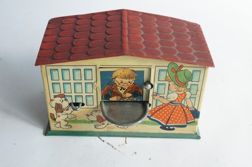 Ancienne tirelire mécanique
