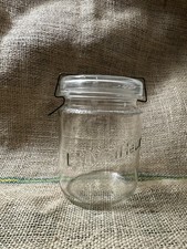 Ancien bocal en verre “Le Meilleur” avec couvercle et fermoir métallique