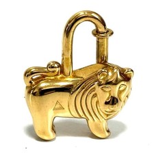 Pendentif breloque sac doré