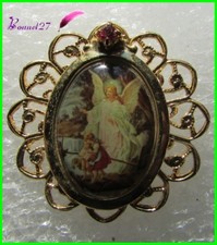 Pin's Image Sainte doré