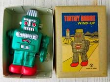 Jouet ancien en étain robot remontoir action printemps Yonezawa vert très bon...