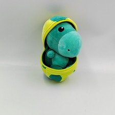 Doudou dinosaure vert dans un