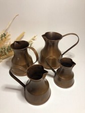 Lot de 4 pichets en cuivre de