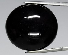 Superbe Grenat rhodolite étoilé tres foncé en cabochon rond de 88.98Cts