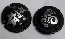 Lot de 2 capsules de Champagne, noir mate à motif divers argenté