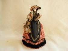 ANTIQUE GERMAN DRESSED PORCELAIN HALF DOLL,LATE 19th.