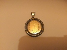Médaille corse acier et or 18 carats 750/000