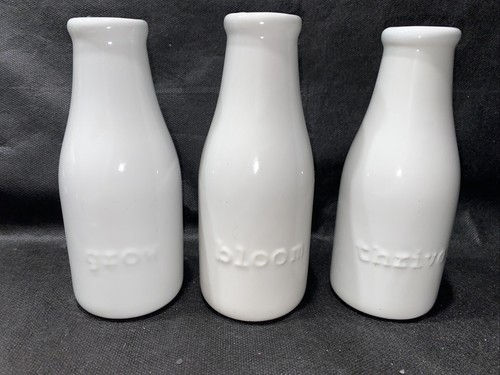 Trio milk bottle vases with - trio, of