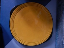 Plat rond longchamp en céramique faience noir et jaune