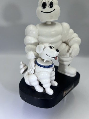 Michelin man bibendum with dog - michelin,
