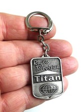 Ancien porte clé métal TITAN Radio Télévision, Années 60.