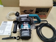 Coupe-béton Makita 4107 R 180 mm avec roues diamantées