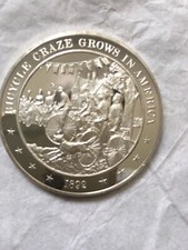 BICYCLE CRAZE GROWS IN AMERICA MARKED STERLING SILVER. 1  3/4 INCHES  ROUND.