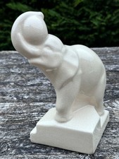 Eléphant jongleur en céramique craquelée
