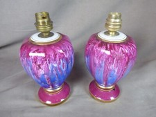 PAIRE DE PIEDS DE LAMPES en porcelaine de Limoges.