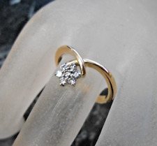 Bague en or jaune massif 18 K sertie de 7 diamants  poincon tete d aigle T58