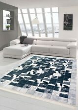 Patchwork de tapis en peau imitation de vache noir gris blanc